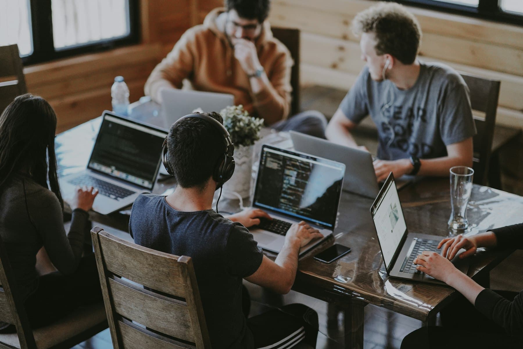 Development team working through a system design at one desk