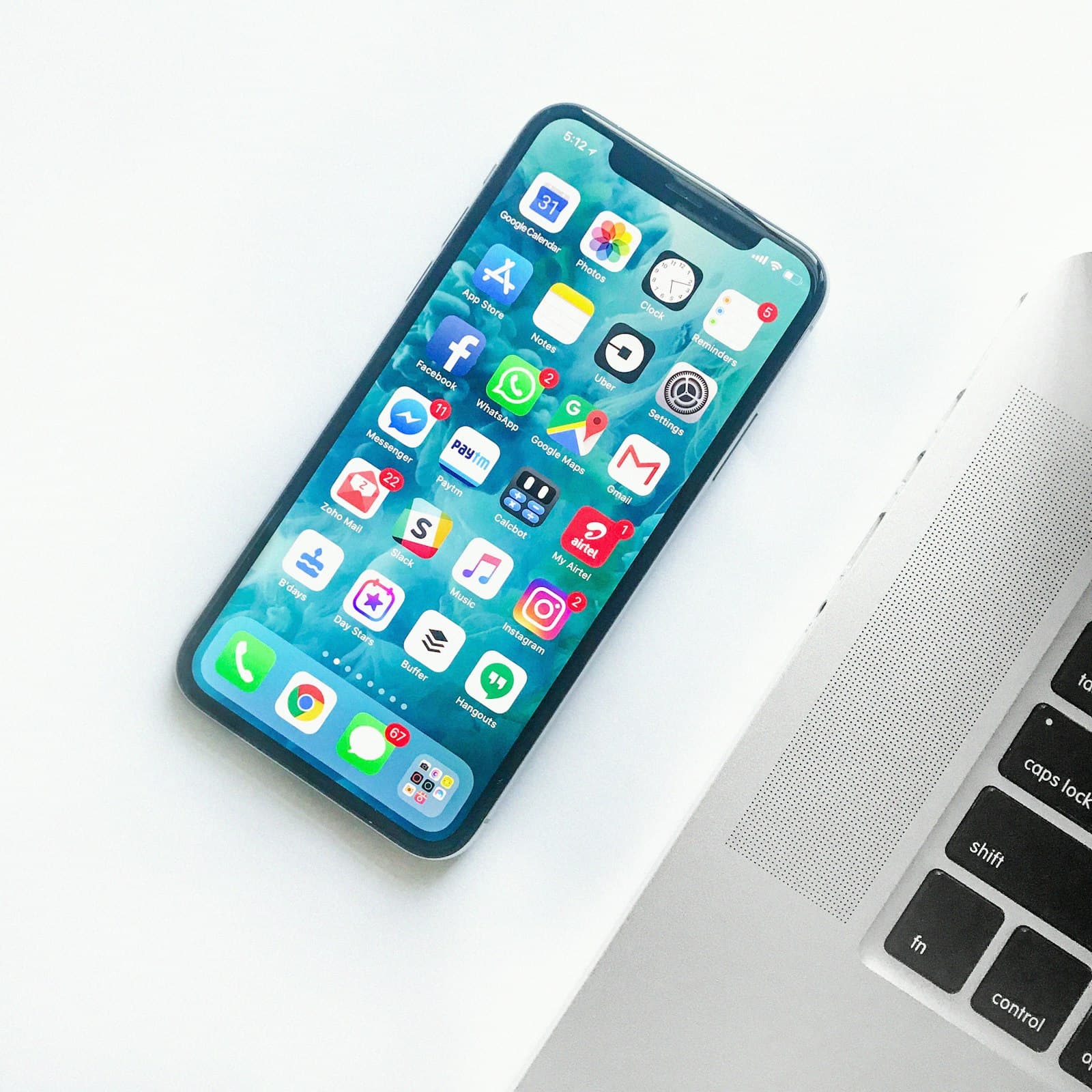 A phone in hand showing a mobile app at work
